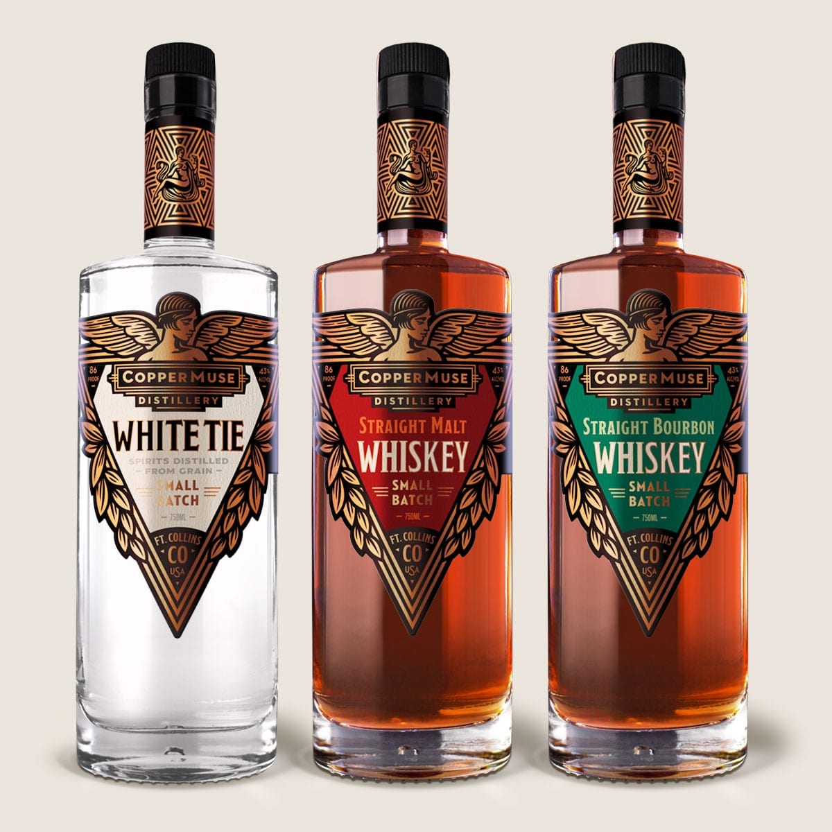 Three bottles of CopperMuse Whiskey with luxurious custom labels.
