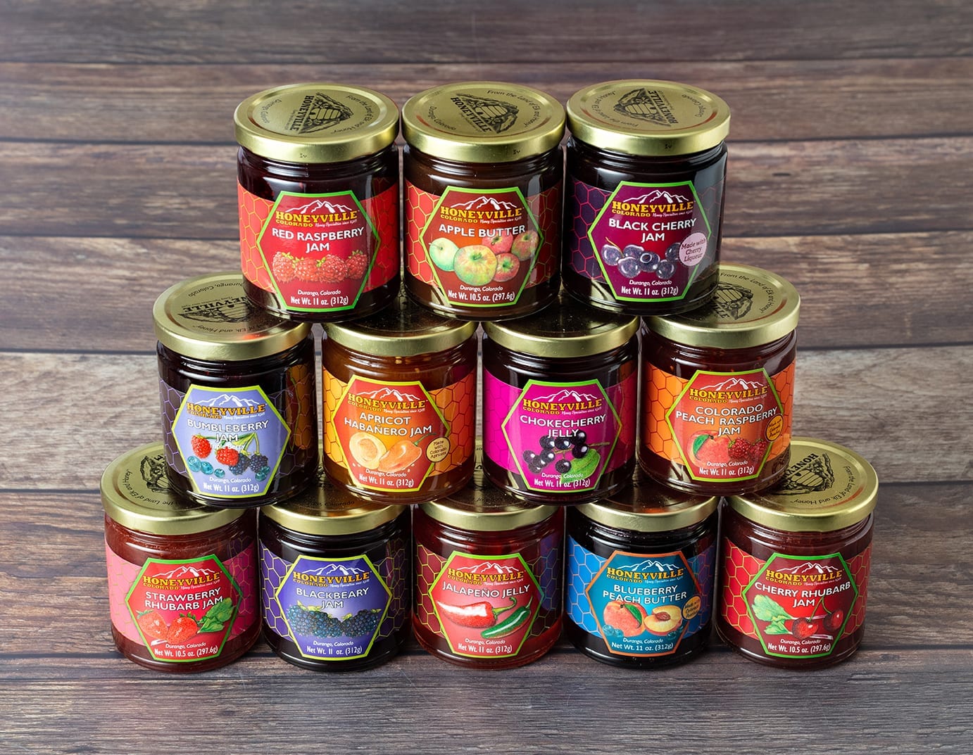 A selection of Honeyville jams and jellies with attractive custom labels designed and printed by Columbine Label Company.