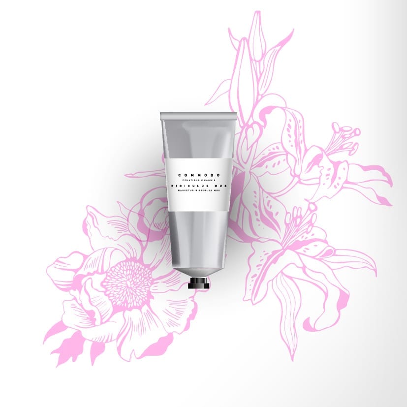 Silver cosmetic cream tube with an appealing new label lying on a pink flower drawing.