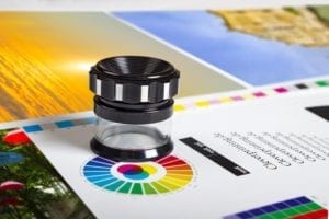 magnifier on top of a paper that has the color wheel printed on it