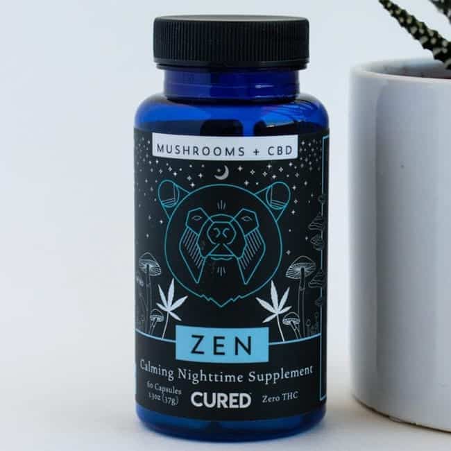 A blue bottle of Calming Nighttime Supplement featuring an interesting custom label made by Columbine Label Company.