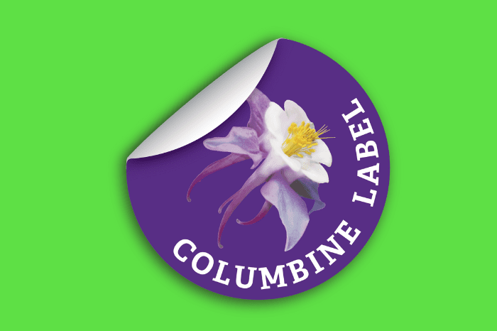 Removing The Columbine Label Company label from the green surface.