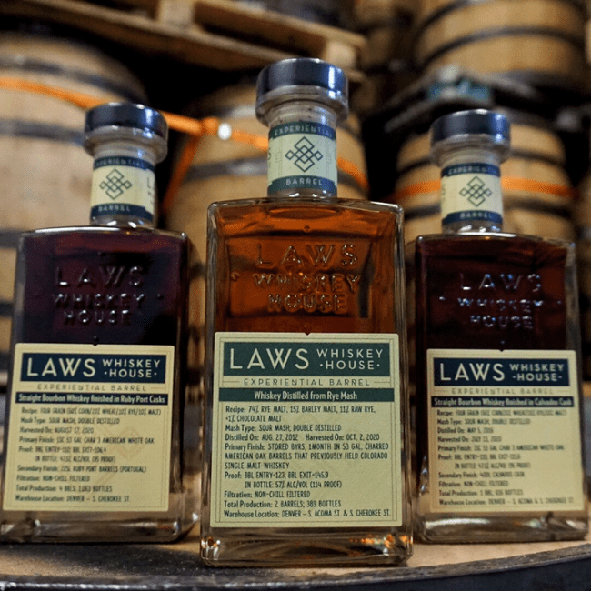 Three Law's Whiskey bottles with custom labels