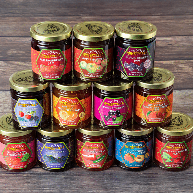 A selection of Honeyville jams and jellies with attractive custom labels designed and printed by Columbine Label Company.