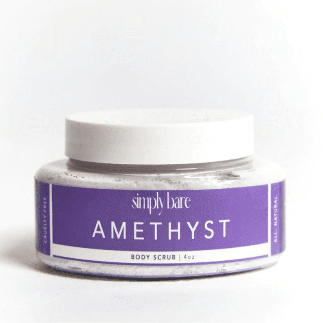 A transparent container of Simply Bare Amethyst Body Scrub with a purple label made by Columbine Label.