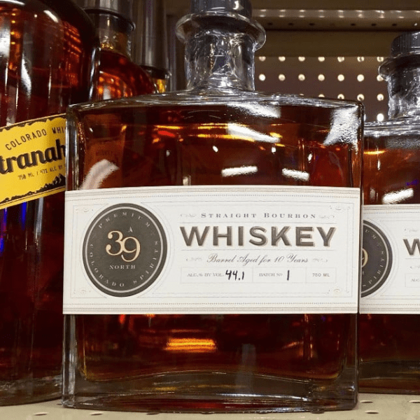 Label created by Columbine Label with an embossed hot stamp on 39 North Whiskey bottles.