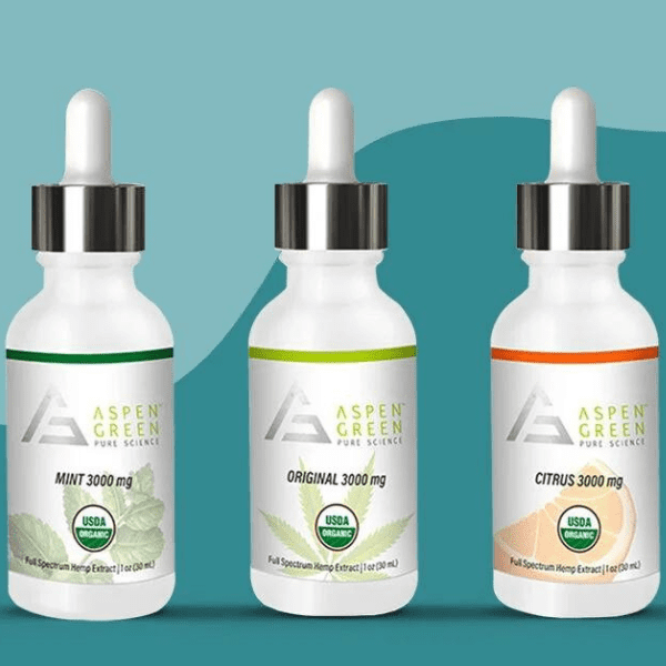 Three dropper bottles of Aspen Green Full Spectrum Hemp Extract with eye-catching labels designed by Columbine Label.
