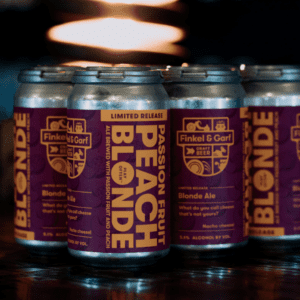 Four cans of Finkel & Garf Passion Fruit Peach Craft beer showing proudly their new labels made by Columbine Label.