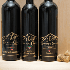 Three black bottles of Colorado Cellars Wines featuring elegant custom labels designed by Columbine Label.