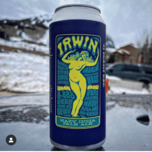 On a blue beer can, a naked woman presents a brand new custom label designed by Columbine Label.